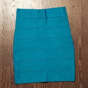 Bebe turquoise body com skirt. Medium